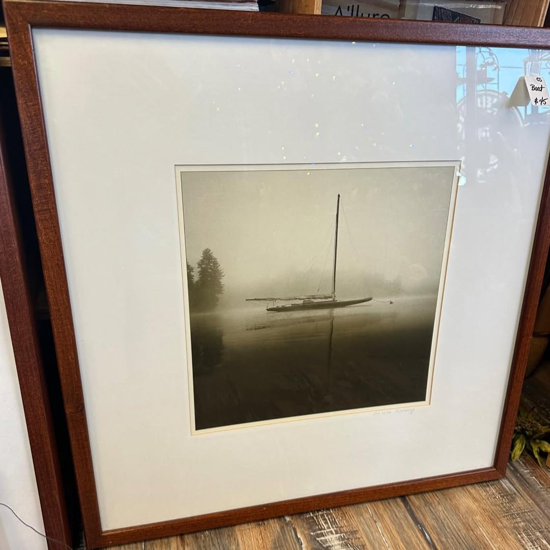 Framed black-and-white sailboat photograph