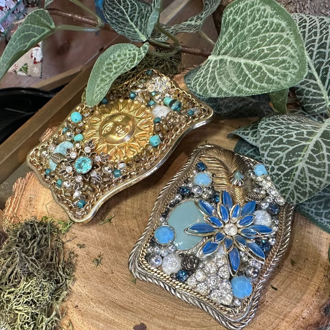Decorative jeweled pieces displayed among greenery